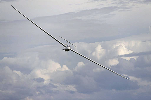 turning-glider-clouds-background-switala_0.jpg